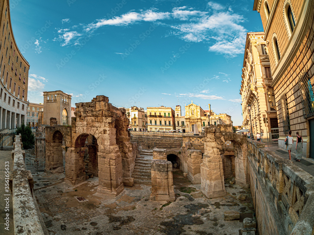 Wide view of the old historical ruins architecture of the Roman amphitheater arena in Lecce city, Italy