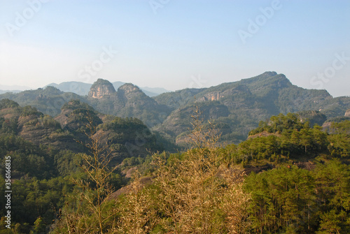 Wuyishan mountains in Fujian Province, China. Scenic view over the peaks of Wuyi mountains. A classic view of the hills from Roaring Tiger Rock. Wuyishan is a UNESCO World Heritage site in China. © Jonathan Wilson