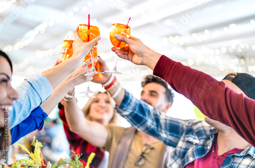 Photography People toasting spritz drink at fashion cocktail bar restaurant - Lifestyle conc