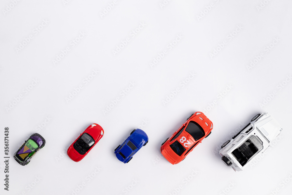 toys constuctor and cars, top view on white background, place for text toys constuctor and cars, top view on white background, place for text