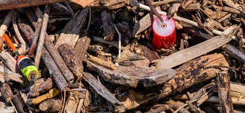 Pollution of plastics mixed with wood by the river