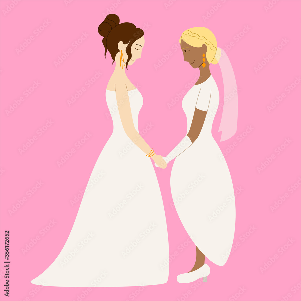 Couple of lesbian brides holding hands at the wedding Couple of lesbian brides holding hands at the wedding