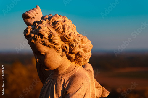 Beautiful statue during sunset at Bogenberg, Danube, Bavaria, Germany photo