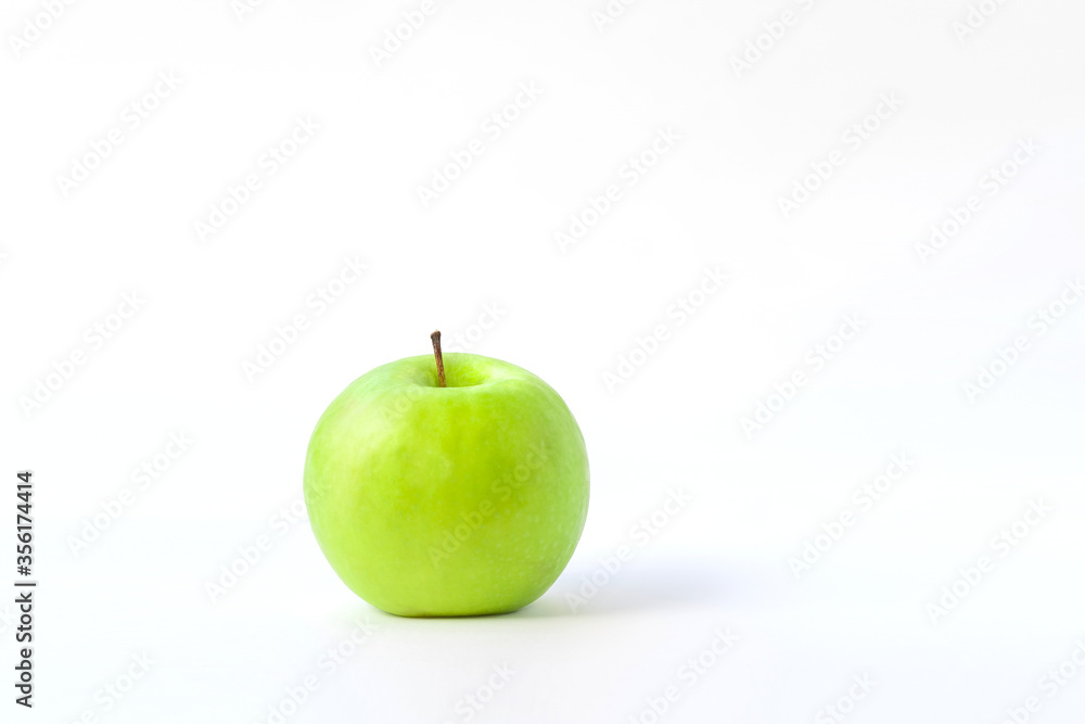 fresh green apple on clear solid and white background in studio light. fresh green apple on clear solid and white background in studio light.