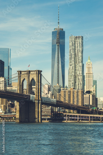 Brooklyn bridge with cityscape of Lower Manhattan skyscrapers skylines bulding New York City. Lower Manhattan is the largest financial district in the world.