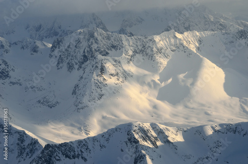 majestic snowy mountain in northern norway aerial overview