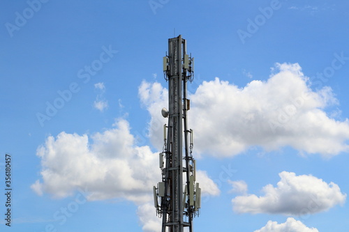 Antenna for communication Behind the blue sky and white clouds