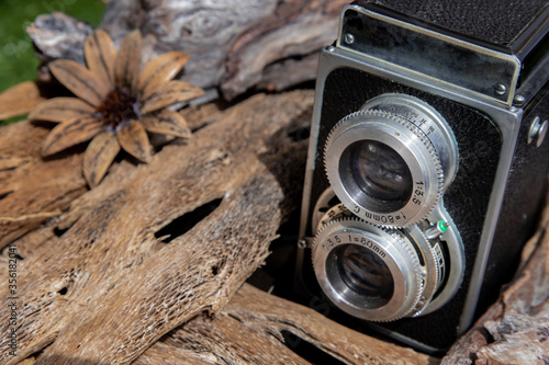 Vintage two lens photo camera on wooden background. An idea of old camera and memory, time Nostalgia. photo