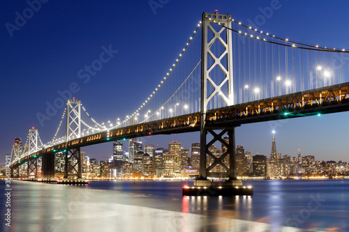 Blue Hour over the Bay Bridge and the city. Yerba Buena Island, San Francisco, California, USA.