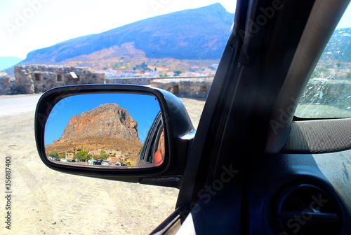 Gova in the sea is reflected in the mirror of a car. Monemvasia. Greece