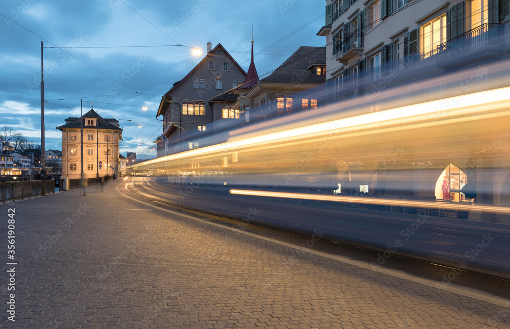 Light trails of a tram in Zurich at the blue hour
