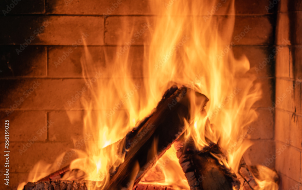 Fire burning in cozy fireplace, christmas, vacation. Fire burning in cozy fireplace, christmas, vacation.