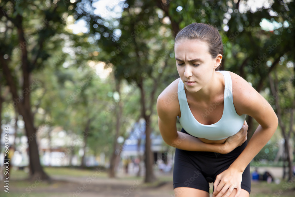 sports woman, fitness woman suffering from stomachache, diarrhea, constipation, food poisoning sports woman, fitness woman suffering from stomachache, diarrhea, constipation, food poisoning