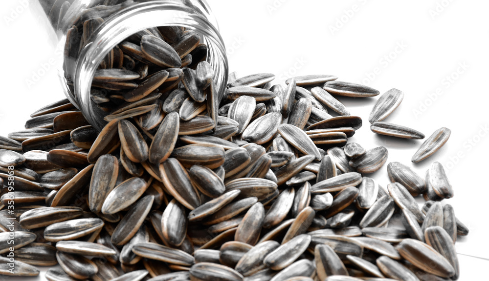A pile of dried sunflower seeds. A pile of dried sunflower seeds.
