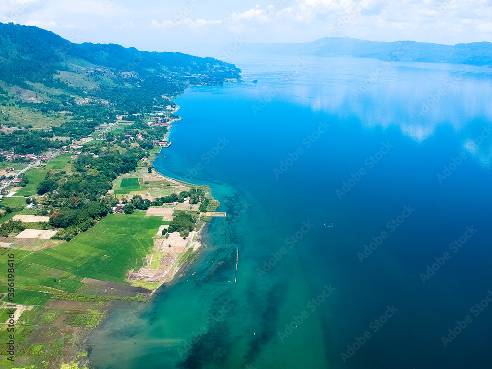 The beautiful aerial view of Lake Toba. Lake Toba is one of the tourist destinations in North Sumatra, Indonesia. The beautiful aerial view of Lake Toba. Lake Toba is one of the tourist destinations in North Sumatra, Indonesia.