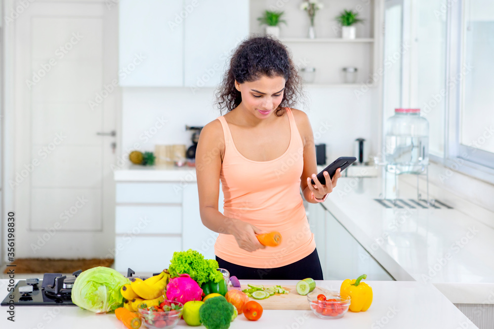 Pretty girl preparing ingredients to make a salad Pretty girl preparing ingredients to make a salad