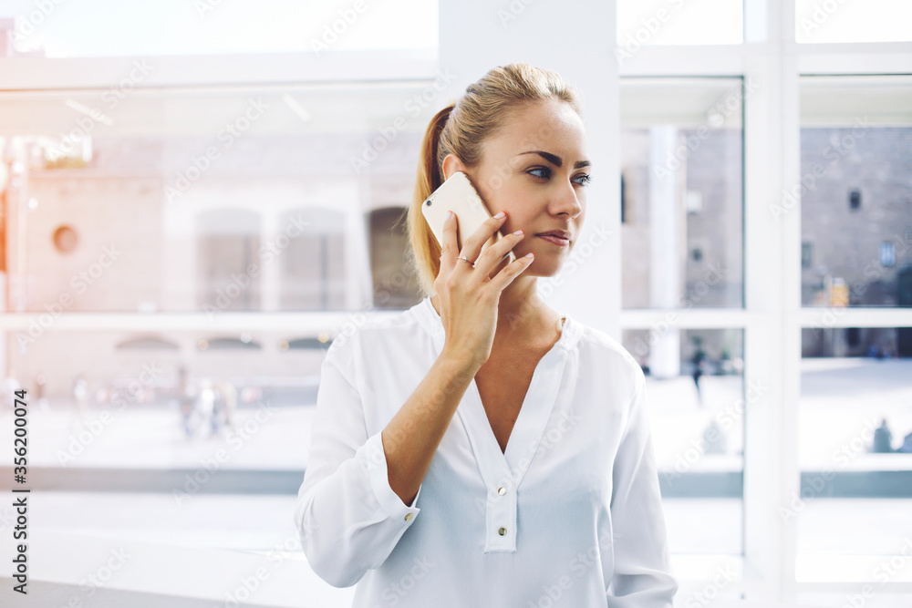 Woman successful lawyer talking on mobile phone after work on digital tablet Woman successful lawyer talking on mobile phone after work on digital tablet
