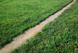 Diagonal empty path at summer park background