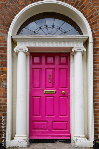 Colorful georgian doors in Dublin, Ireland. Historic doors in different colors painted as protest against English King George legal reign over the city of Dublin in Ireland © Irina Schmidt