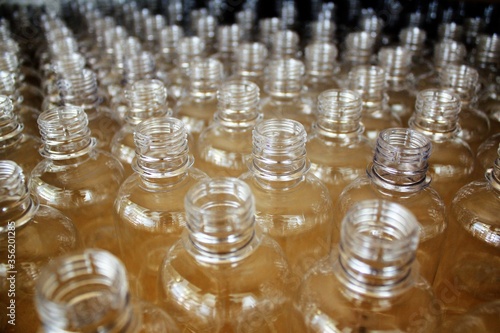 Clean plastic bottles stacked in a factory.