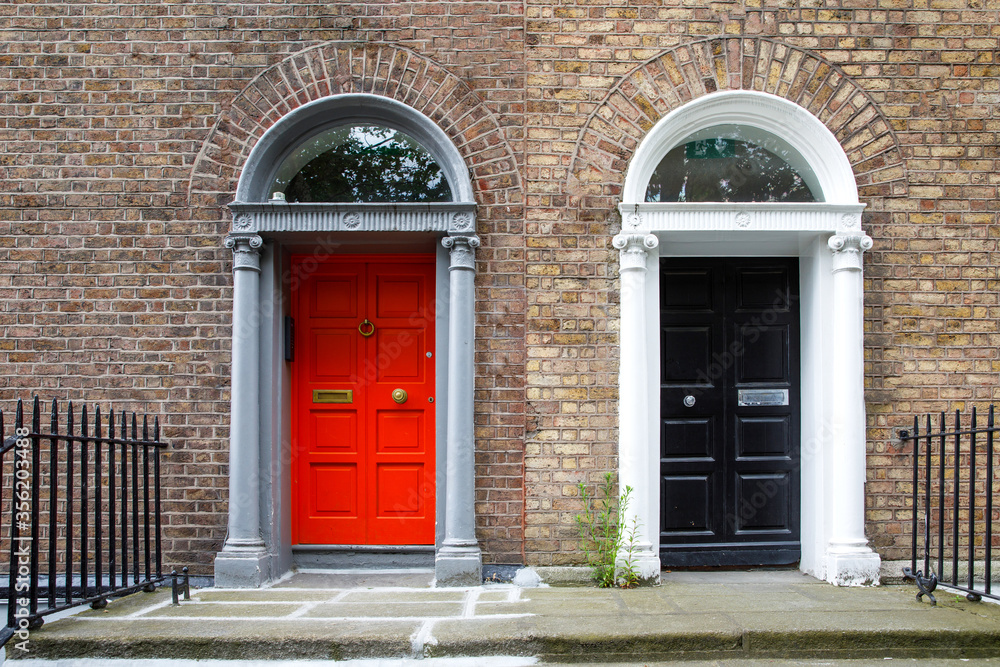 Fototapeta premium Colorful georgian doors in Dublin, Ireland. Historic doors in different colors painted as protest against English King George legal reign over the city of Dublin in Ireland