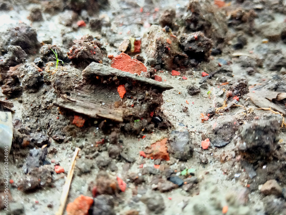 Macro Shot of Wet Soil with Tiny Brick, Sand and Gravel Macro Shot of Wet Soil with Tiny Brick, Sand and Gravel