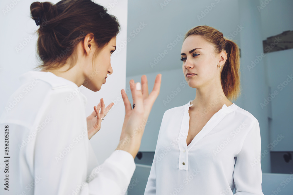 Bad-tempered business executive yelling on her employee after unfortunate meeting Bad-tempered business executive yelling on her employee after unfortunate meeting
