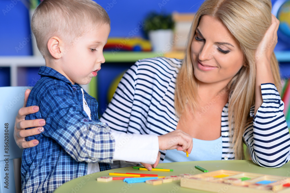 Young mother and cute little son playing Young mother and cute little son playing