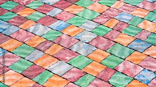 Colored rubber square paving slab for playgrounds close-up
