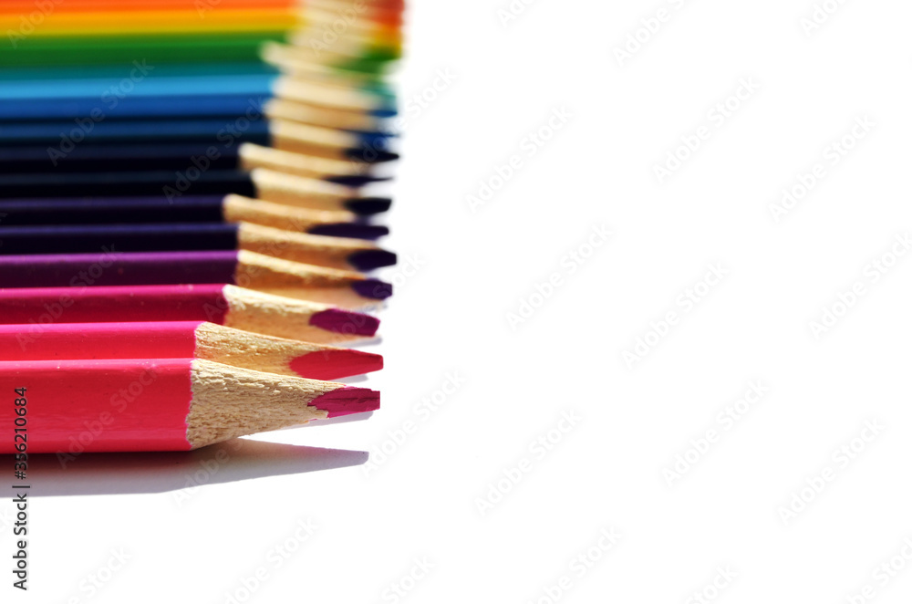 colored pencils close-up macro on a white background with copy space colored pencils close-up macro on a white background with copy space