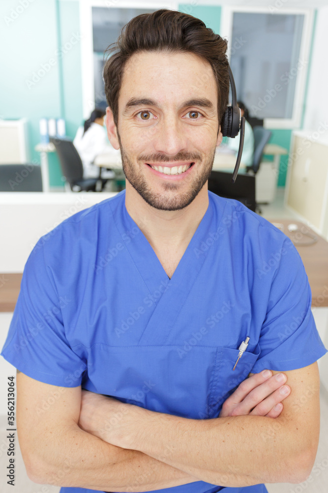 male worker on the reception of a hospital male worker on the reception of a hospital
