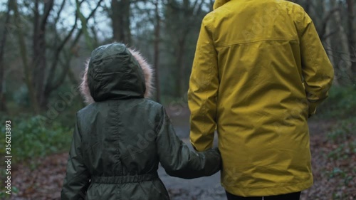 Wallpaper Mural MS TS Mother and daughter (8-9) walking in forest / Norwich, Norfolk, England, UK Torontodigital.ca