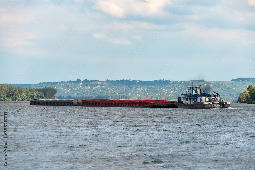 Ivanovo, Serbia - May 31, 2020: A ships from the Danube River in the territory of Serbia near Ivanovo. 