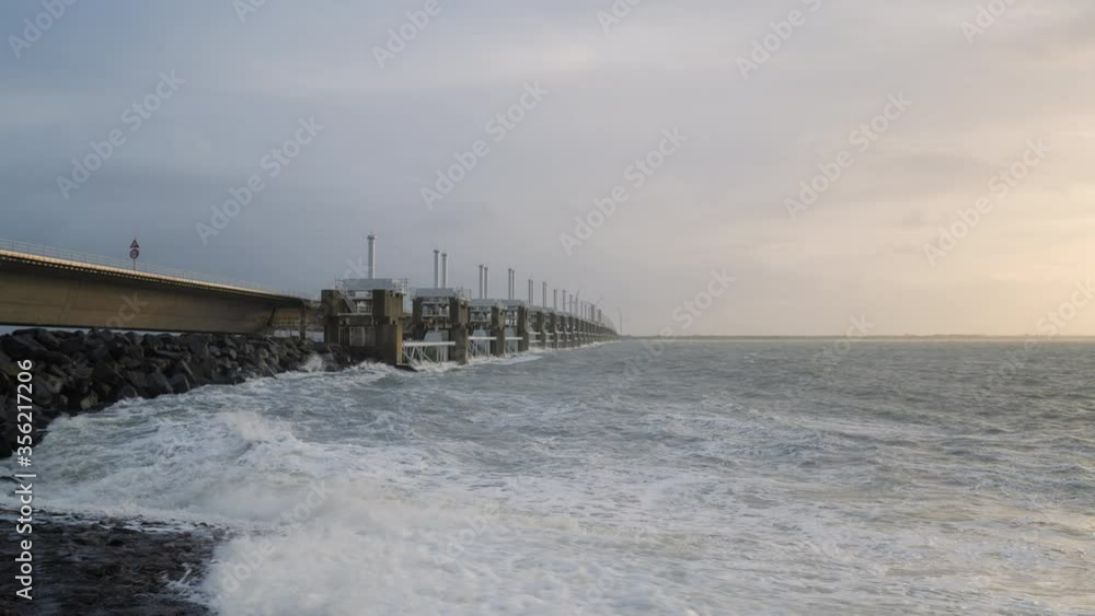 WS SLO MO PAN Waves hitting Oosterscheldekering flood barrier on stormy day / Vrouwenpolder, Zeeland, Netherlands WS SLO MO PAN Waves hitting Oosterscheldekering flood barrier on stormy day / Vrouwenpolder, Zeeland, Netherlands