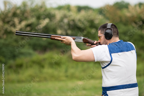 Man shooting on an outdoor shooting range