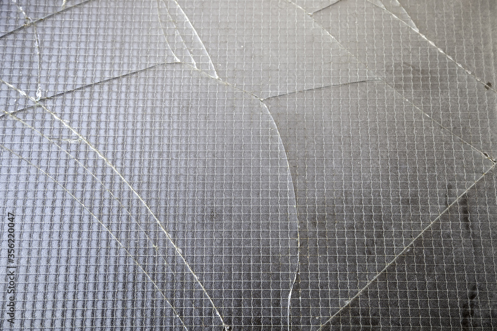 Obraz premium Broken window with bars