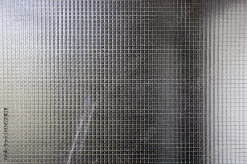 Glass with metal grill