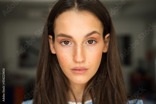 Young beautiful brunette woman close up portrait