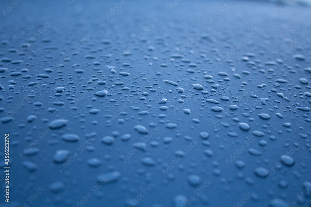Obraz premium water drops on blue background