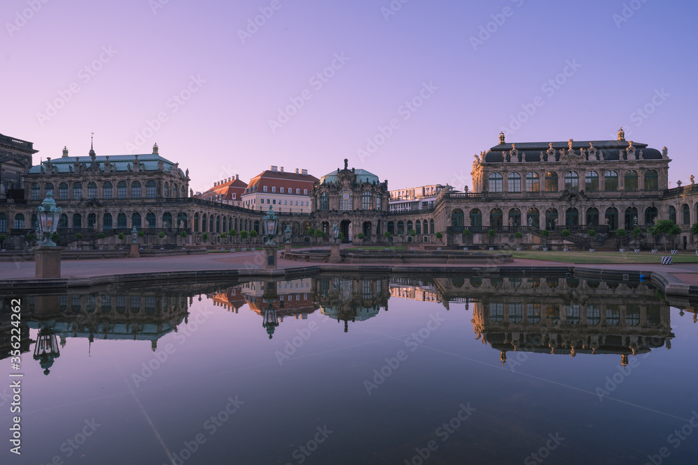 Inside the Zwinger in the old town of Dresden, Germany in the morning with reflections in the water. Inside the Zwinger in the old town of Dresden, Germany in the morning with reflections in the water.