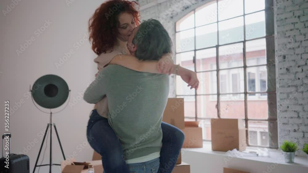 WS Couple hugging and spinning around in new apartment / Milan, Italy WS Couple hugging and spinning around in new apartment / Milan, Italy