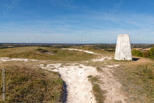 Canvas Print A triangulation station, or pillar, sits atop the knoll where a medieval castle once stood, with just the land works remaining