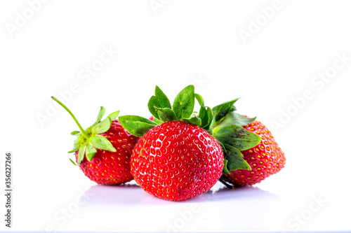 Close up  Strawberry with green leaves  on white background