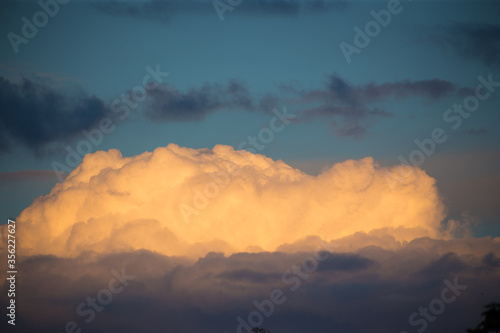 Beautiful magnificent clouds at sunset in the sky © Hennadii