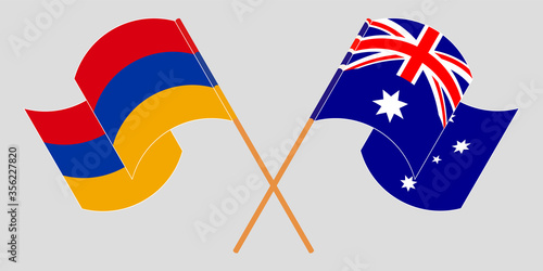 Crossed and waving flags of Armenia and Australia