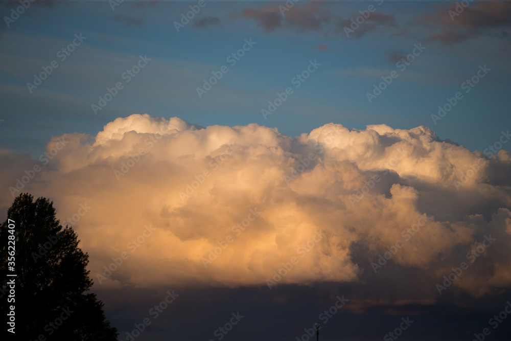 Beautiful magnificent clouds at sunset in the sky Beautiful magnificent clouds at sunset in the sky