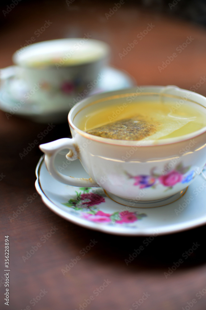 Cup of tea reflected in mirror Cup of tea reflected in mirror