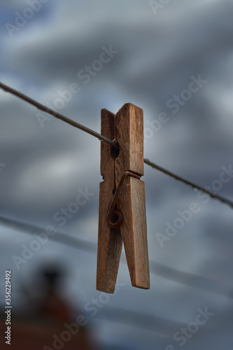 Wooden clothespin on a clothesline