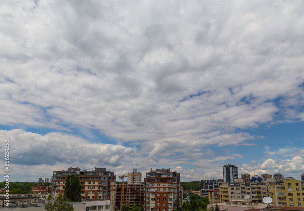 Fototapeta premium clouds over the city