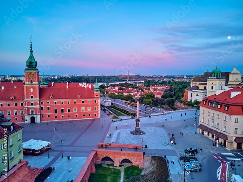 Beautiful panoramic aerial drone view on Warsaw Old town (POL: Stare Miasto) - the oldest district of Warsaw (13th century), Royal Castle, square and the Column of Sigismund III Vasa at sunset, Poland photo